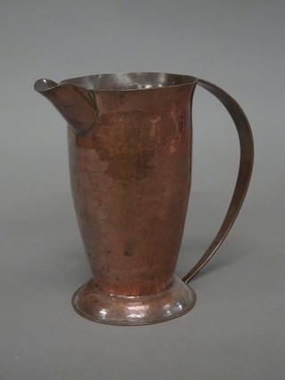 An Art Nouveau style hammered copper jug 7"