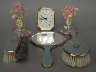A gilt metal dressing table set, 2 pink glass scent bottles and a battery operated clock