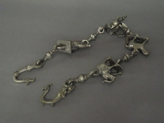 An Eastern metal elephant chain hung figures of elephants and horses