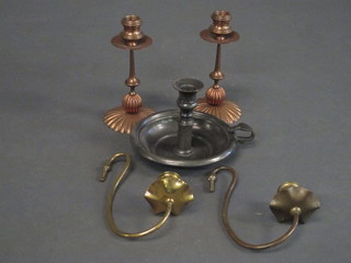 A pewter chamber stick the base with touch marks and 2 copper candlesticks with brass sconces