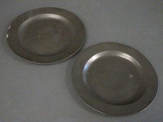A pair of 18th Century circular pewter plates with touch marks  9"