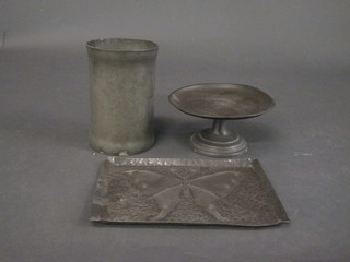 A cylindrical pewter vase 7", do. comport 8" and an embossed  tray decorated butterfly 11"