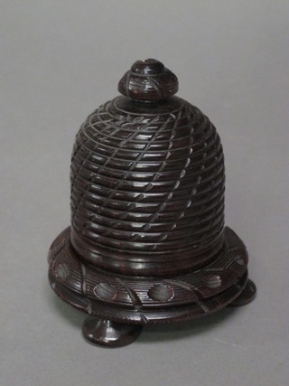 A 19th Century turned wooden string box in the form of a  beehive, raised on 4 bun feet 4"
