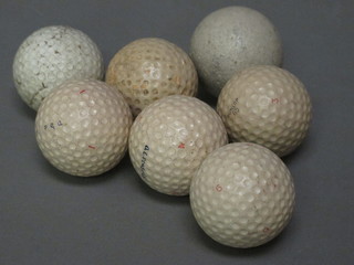 A Teemee golf ball, an Speeding Flite golf ball, 2 A E Penfold golf balls, 2 Dunlop 65 golf balls and 1 other ball