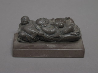 A paperweight in the form of a reclining Oriental gentleman 5"