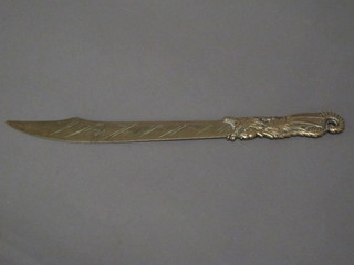 An Eastern gilt metal paper knife the handle in the form of a  dragon with seal mark 11"