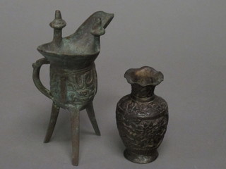 An Eastern bronze club shaped vase 4" and 1 other spouted vase raised on 3 feet