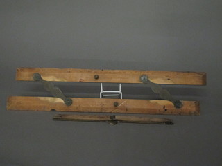 A wooden 24" gauge and a Captain Fields improved wooden  parallel ruler