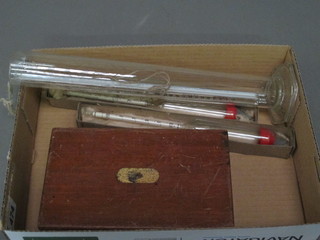 A boxed set of drawing instruments, 2 hydrometers, 3 thermometers etc