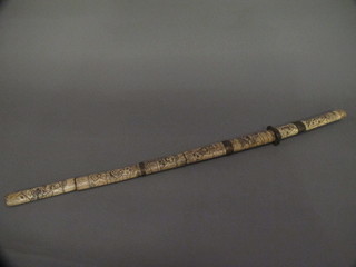 A Wakazashi with 16" blade contained in a carved bone scabbard
