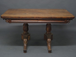 A rectangular William IV rosewood library table fitted 2  drawers, raised on 2 turned columns with scroll feet 54"