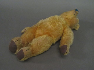 A yellow teddybear with articulated limbs 18"