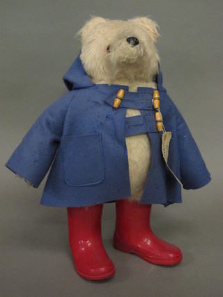A Paddington bear complete with label, no hat and mothed coat,