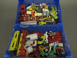 2 green plastic crates containing a collection of toys cars