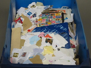 A blue crate containing a collection of stamps