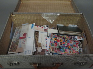 An attache case containing various stamps