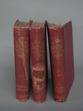 3 red Imperial stamp albums