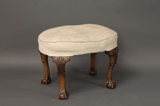 An oval Queen Anne style walnut stool raised on cabriole  supports 25"