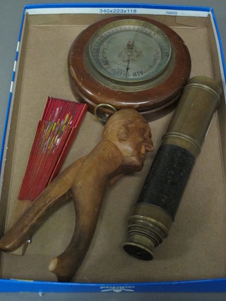 A pair of novelty nut crackers, a 3 draw telescope, a barometer with silver dial and a fan