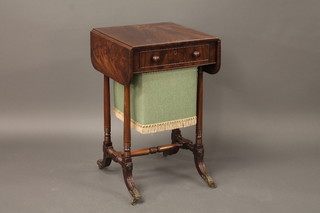A Victorian rectangular drop flap mahogany work table, fitted a  drawer with deep basket, raised on turned supports ending in  brass caps and castors 17"