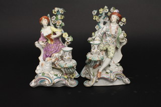 A handsome pair of 19th Century Samson porcelain candlesticks  supported by a figure of a Shepherd and Shepherdess, 10",  having gold anchor marks to the base  ILLUSTRATED