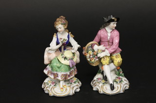 A pair of 19th Century Samson porcelain figures of a seated  gentleman with basket of flowers and a lady with bonnet, 5 1/2"