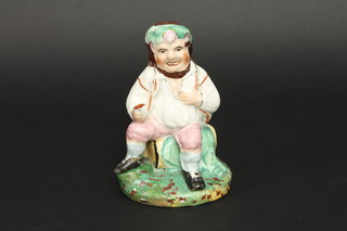 A 19th Century Staffordshire figure of a seated Bacchus 7"