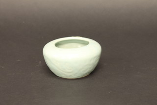 An Oriental Celadon bowl of squat form, 4"