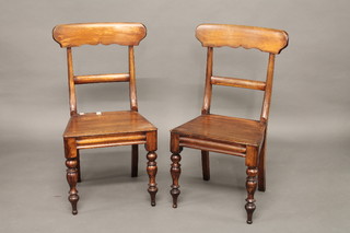 A pair of 19th Century style mahogany bar back chairs with  rectangular mid rails and solid seats, raised on turned supports