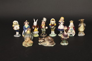 An 11 piece Beswick Alice in Wonderland set of figures  including Alice, White Rabbit, Mock Turtle, Mad Hatter, Cheshire Cat, Gryphon, King of Hearts, Queen of Hearts, Fish  Footman and Frog Footman