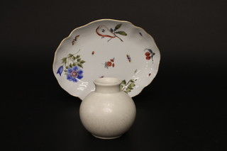A circular white glazed goblet shaped Poole vase 4" together with  a Herland porcelain dish decorated fruit and insects 10"