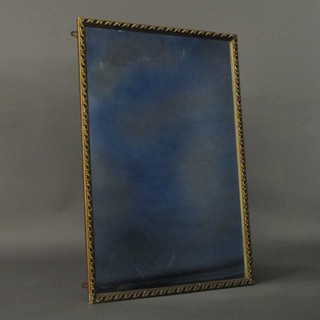 A rectangular plate mirror contained in a decorative gilt frame 38" x 25"