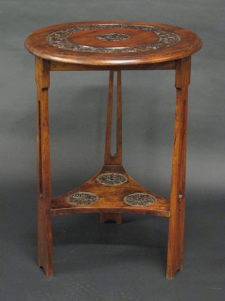 An Art Nouveau circular carved mahogany 2 tier cricket table,  raised on pierced supports 22"