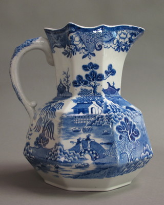 A Masons Ironstone China blue and white glazed Willow Pattern  pottery jug decorated pagodas, the base with blue Masons mark,  10"  ..jay