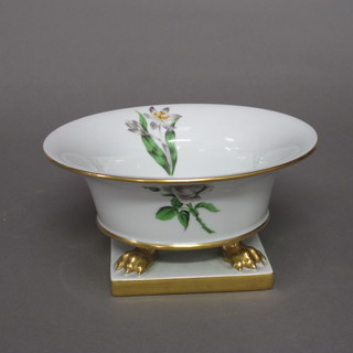 A circular hand painted porcelain bowl with floral decoration 8"