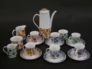 An Elizabethan Carnaby pattern coffee service comprising coffee  pot, 2 cream jugs, 2 sugar bowls - 1 cracked, 6 coffee cans - 2  cracked and 6 saucers