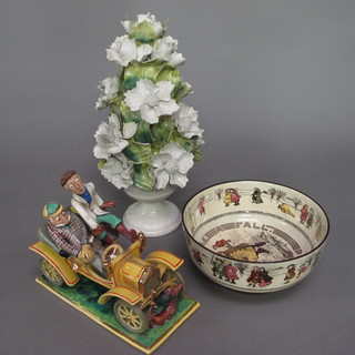 A circular Doulton seriesware bowl decorated ice skaters 8", an  Italian porcelain floral ornament in the form of a vase of flowers  11" and an Italian pottery ornament in the form of a vintage car
