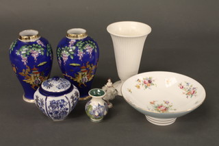 A pair of Noritake blue ground vases decorated Pagodas 8", a  circular Minton bowl with floral decoration 9", a white glazed  Wedgwood vase 8" - chip to rim etc