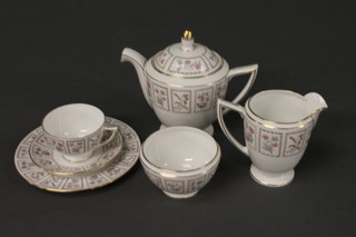 A 31 piece Minton Tapestry pattern tea service comprising a pair  of 9" shaped bread and butter plates, 6 8" tea plates, 3 breakfast  cups and saucers, 6 tea cups and saucers, cream jug, milk jug,  sugar bowl and teapot