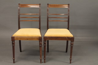 A pair of 19th Century bar and ladder back bedroom chairs with upholstered drop in seats, raised on turned supports
