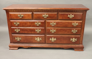 A Georgian style mahogany chest of 3 short and 6 long drawers raised on bracket feet 55"