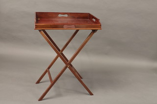 A rectangular mahogany butler's tray complete with folding stand  25"