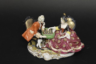 A Dresden style porcelain figure group "The Chess Game" 9", raised on a shaped oval base