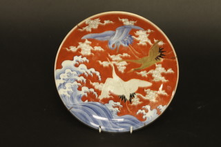 A circular Oriental porcelain plate decorated storks, the reverse  with 3 character mark 9"