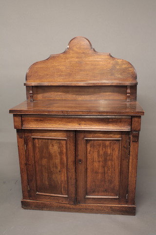 A Victorian mahogany chiffonier with raised shelved back, the  base fitted a drawer above a cupboard enclosed by panelled  doors, raised on a platform base 38 1/2"   ILLUSTRATED
