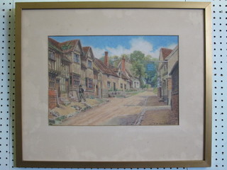 C N Heathcote, watercolour "Village Street Scene with Pub and  Figure Walking" 10" x 14"