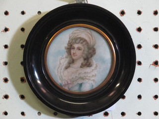 An ivory portrait miniature "Noble Lady" contained in an ebonised socle frame  ILLUSTRATED