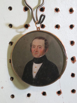 A 19th Century portrait miniature of a gentleman contained in a  circular gilt mount 2 1/2"