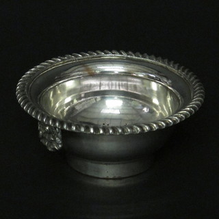 The top section of a silver plated wine funnel