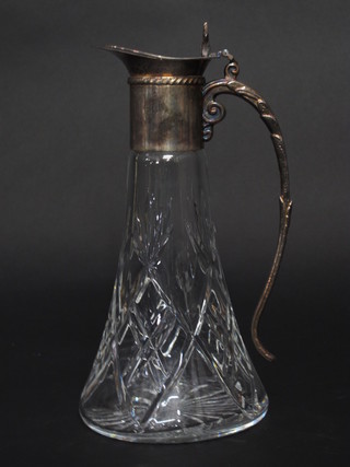 A cut glass claret jug with silver plated mounts  ILLUSTRATED